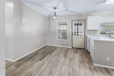This newly remodeled manufactured home is located in the - photo 8