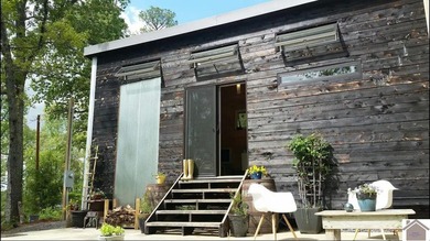 Charming tiny home nestled near picturesque Kentucky Lake! This - photo 2