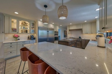 Nestled on a beautifully landscaped half-acre lot in one of - photo 18