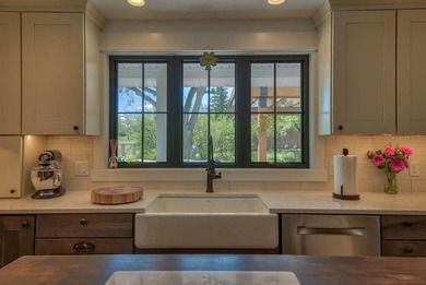 Nestled on a beautifully landscaped half-acre lot in one of - photo 19