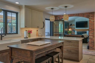 Nestled on a beautifully landscaped half-acre lot in one of - photo 21