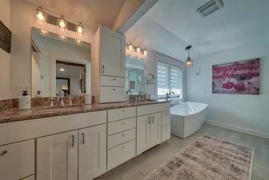 Nestled on a beautifully landscaped half-acre lot in one of - photo 48