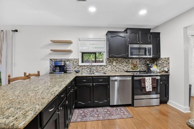 This charming home boasts hardwood floors throughout, granite - photo 10