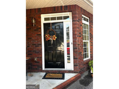 Welcome home to this charming 2-bedroom, 2-bath, all brick condo - photo 2