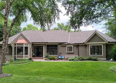 RARE FIND! Charming villa-styled home offers GATED SECURITY, a - photo 1