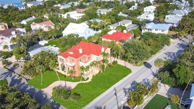 Experience the timeless coastal allure of 15160 Captiva Drive, a - photo 2