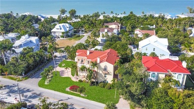 Experience the timeless coastal allure of 15160 Captiva Drive, a - photo 3