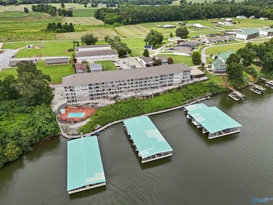 WATERFRONT CONDO WITH PRIVATE BOAT SLIP & LIFT! Enjoy - photo 1