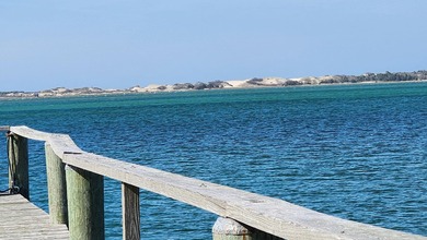 Set along the shores of Barnstable Harbor at the end of a - photo 32