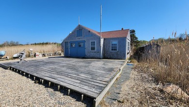 Set along the shores of Barnstable Harbor at the end of a - photo 33