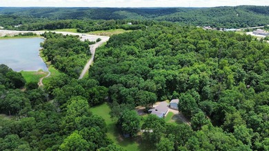 Tucked away on 13.62+/- surveyed acres in the rolling Ozark - photo 2
