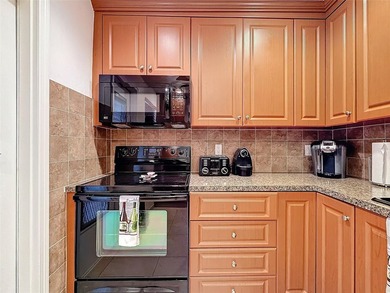 Step inside to discover an updated kitchen with modern finishes - photo 12