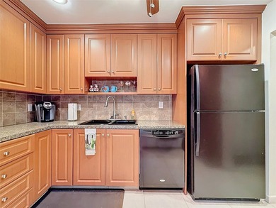 Step inside to discover an updated kitchen with modern finishes - photo 13