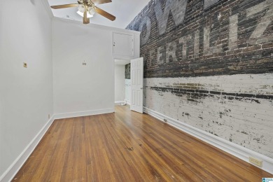 Exposed brick wall, floor to ceiling windows, exposed cedar