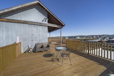 Exposed brick wall, floor to ceiling windows, exposed cedar