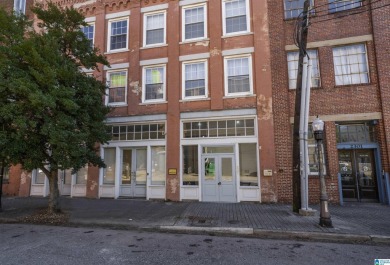 Exposed brick wall, floor to ceiling windows, exposed cedar