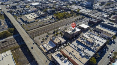 Exposed brick wall, floor to ceiling windows, exposed cedar