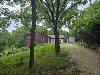 Nice country home on a paved road with a beautiful treed lot and - photo 1
