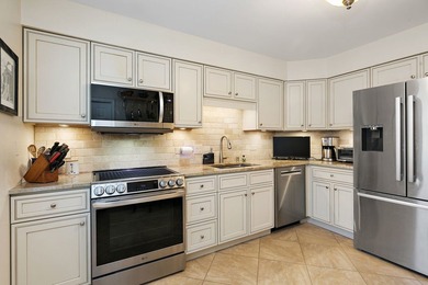 Enjoy resort-style, MAIN FLOOR, living in this beautifully - photo 6