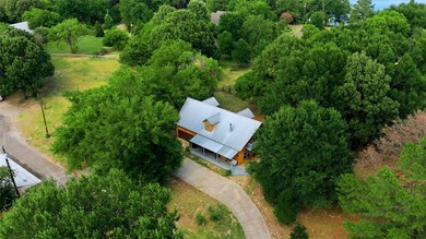 Enjoy the beauty of lake living in this spacious 4-bedroom - photo 1