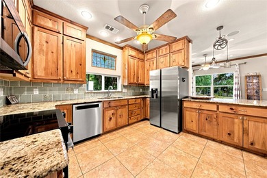 Enjoy the beauty of lake living in this spacious 4-bedroom - photo 8