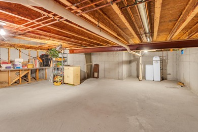 SOUGHT AFTER STAND ALONE CONDO IN SUMMIT TOWNSHIP! Striking curb