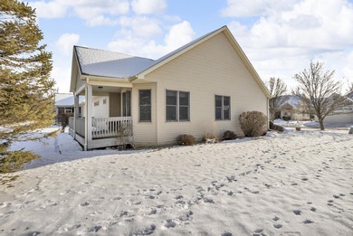 SOUGHT AFTER STAND ALONE CONDO IN SUMMIT TOWNSHIP! Striking curb