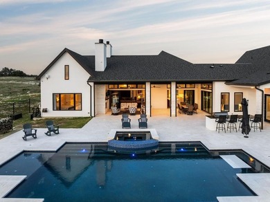 Set on 5.01 acres with a seasonal creek and natural spring, this - photo 2