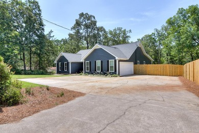 Located just 20 minutes from Evans, this updated Modoc lakehouse - photo 3