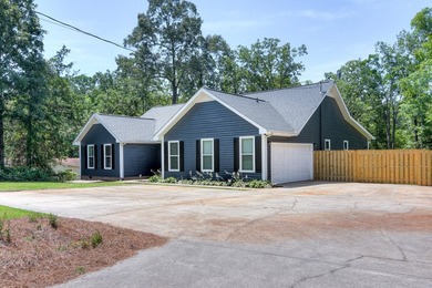 Located just 20 minutes from Evans, this updated Modoc lakehouse - photo 4