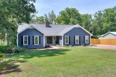 Located just 20 minutes from Evans, this updated Modoc lakehouse - photo 5