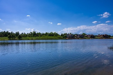This beautiful lot on Stone Gate Lake offers sunset views and a - photo 10