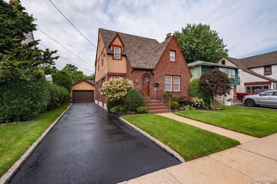 Oozing with charm this meticulously maintained brick Tudor is a - photo 2