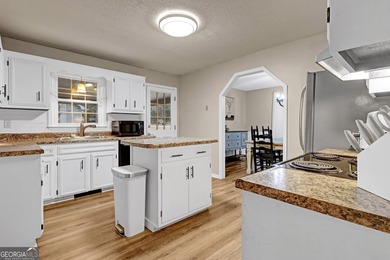 Welcome to this beautifully maintained four-bedroom, two-bath - photo 5