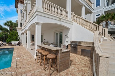 Perched on an oversized homesite in Hammock Beach, this 5,300 sq