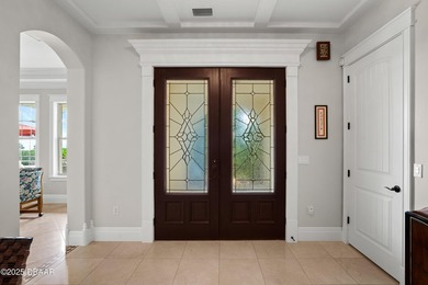 Perched on an oversized homesite in Hammock Beach, this 5,300 sq