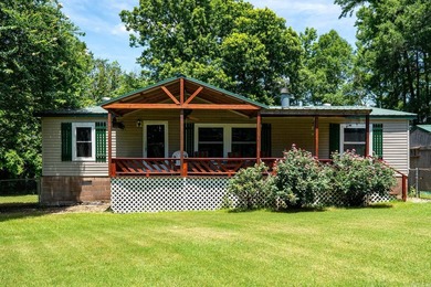 Enjoy lakefront living with this 3 bedroom, 2 bath home, sitting - photo 2
