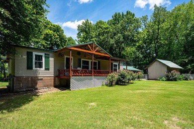 Enjoy lakefront living with this 3 bedroom, 2 bath home, sitting - photo 3
