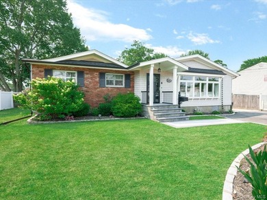 Welcome to 66 Moffitt Boulevard, a spacious three-bedroom - photo 1