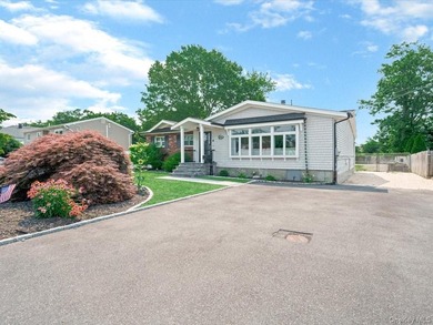 Welcome to 66 Moffitt Boulevard, a spacious three-bedroom - photo 2