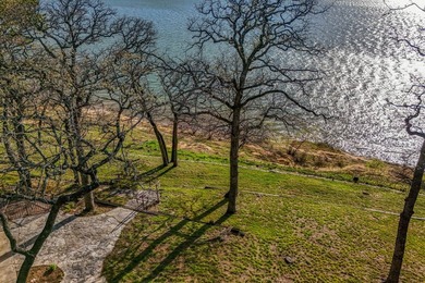 Set high above the shoreline on a commanding bluff, this rare 1 - photo 10