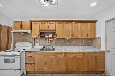 Solid brick home offering endless potential! Features include a - photo 8