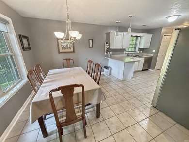Check out this all brick home located near the golf course in - photo 4