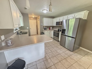 Check out this all brick home located near the golf course in - photo 5