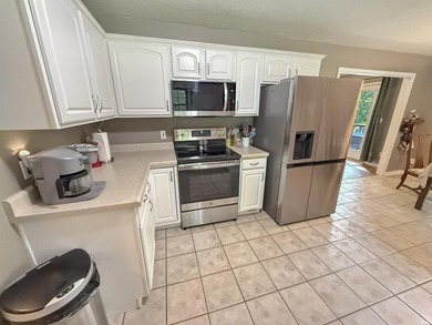 Check out this all brick home located near the golf course in - photo 6
