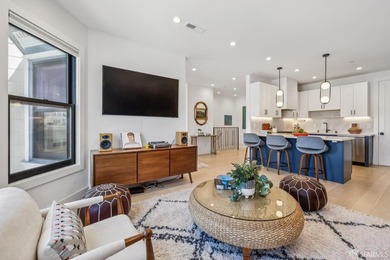 Thoughtfully renovated in 2023, this exceptional bi-level upper - photo 1