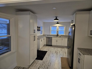 Kitchen has been remodeled, with new, cabinets, flooring and - photo 10