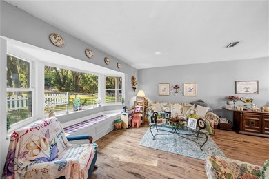Tucked away on beautiful Lake Weir, this charming gated - photo 3