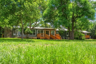 This peaceful property is just minutes from town offering both - photo 1