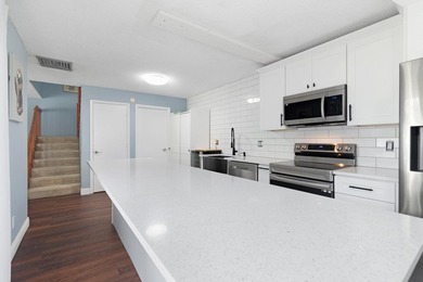 Updated 2 bedroom, 2.5-bathroom DiVosta built townhouse in the - photo 11